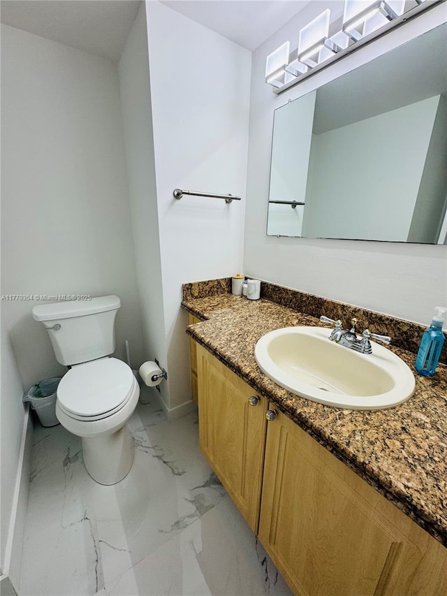 18071 Biscayne Blvd Unit 1503, Aventura, FL 33160 - bathroom with marble finish floors, baseboards, toilet, and vanity