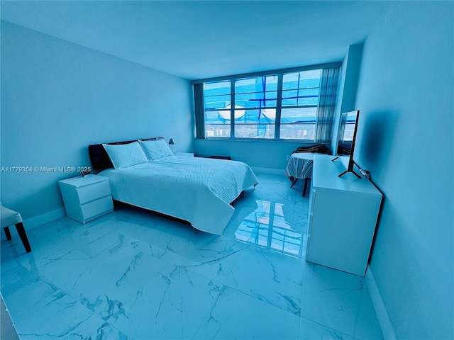18071 Biscayne Blvd Unit 1503, Aventura, FL 33160 - bedroom featuring marble look tiles and baseboards