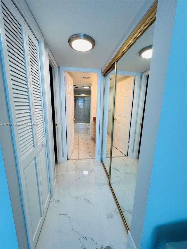 18071 Biscayne Blvd Unit 1503, Aventura, FL 33160 - hall featuring light marble finish floors and baseboards