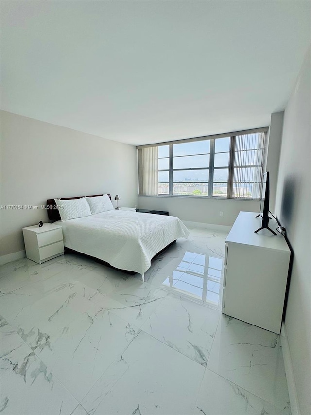 18071 Biscayne Blvd Unit 1503, Aventura, FL 33160 - bedroom featuring light marble finish floors