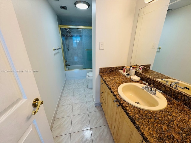 18071 Biscayne Blvd Unit 1503, Aventura, FL 33160 - bathroom featuring toilet, vanity, tile patterned floors, and combined bath / shower with glass door
