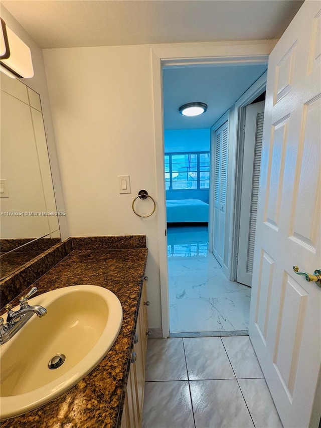 18071 Biscayne Blvd Unit 1503, Aventura, FL 33160 - bathroom with marble finish flooring, vanity, and baseboards