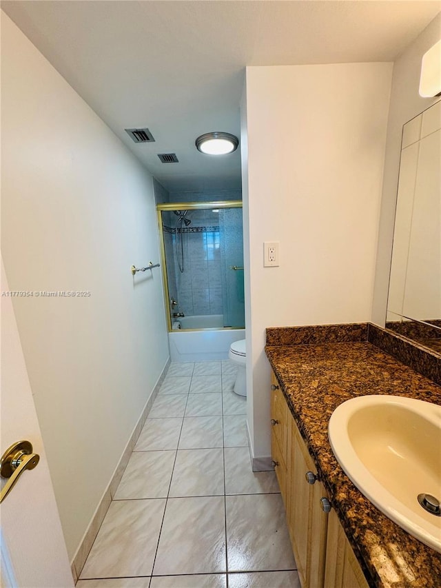 18071 Biscayne Blvd Unit 1503, Aventura, FL 33160 - full bath featuring vanity, toilet, enclosed tub / shower combo, baseboards, and tile patterned floors
