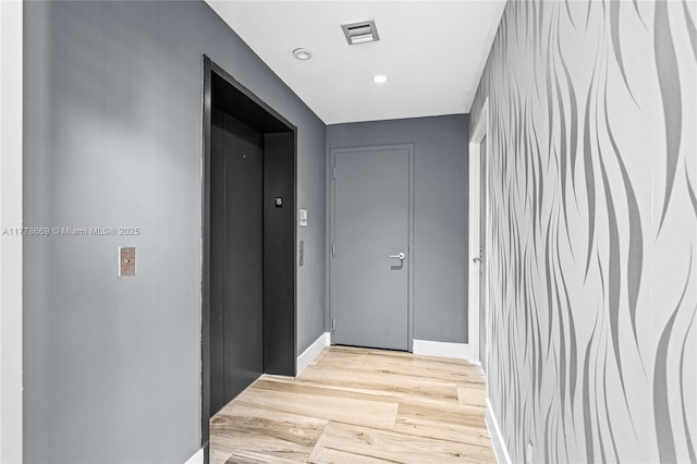 2900 NE 7th Ave Unit 1609, Miami, FL 33137 - hallway with light wood-style flooring and recessed lighting