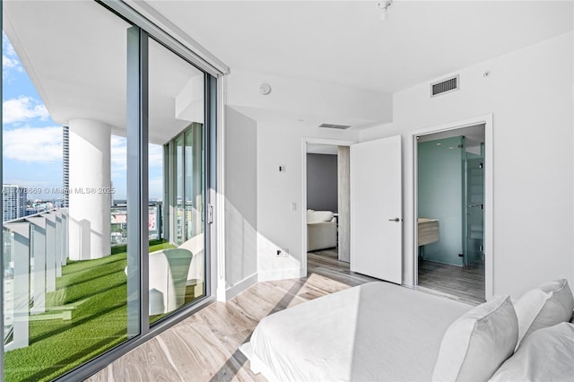 2900 NE 7th Ave Unit 1609, Miami, FL 33137 - bedroom featuring wood finished floors and connected bathroom