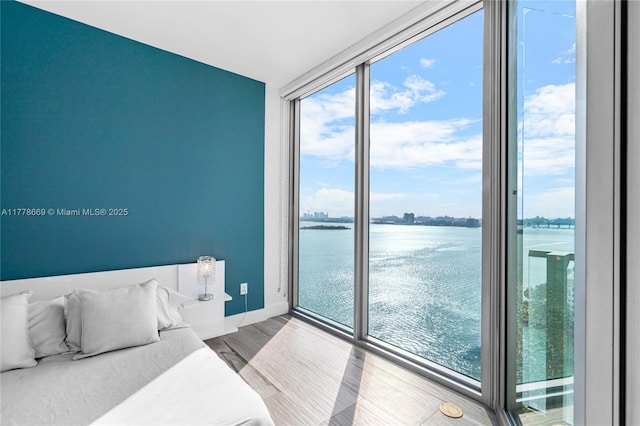 2900 NE 7th Ave Unit 1609, Miami, FL 33137 - bedroom featuring a water view and wood finished floors