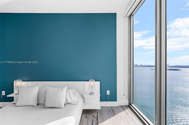 2900 NE 7th Ave Unit 1609, Miami, FL 33137 - bedroom with wood finished floors, a water view, and multiple windows