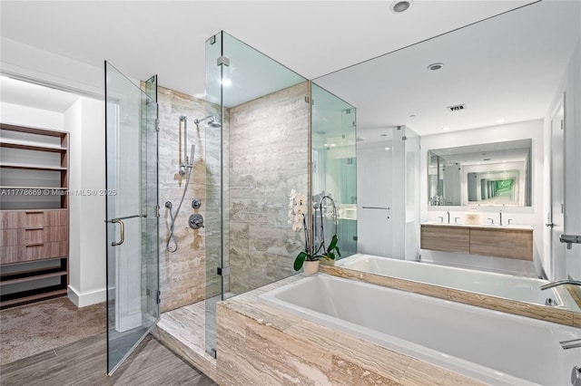 2900 NE 7th Ave Unit 1609, Miami, FL 33137 - full bath featuring a bath, a shower stall, vanity, wood finished floors, and recessed lighting