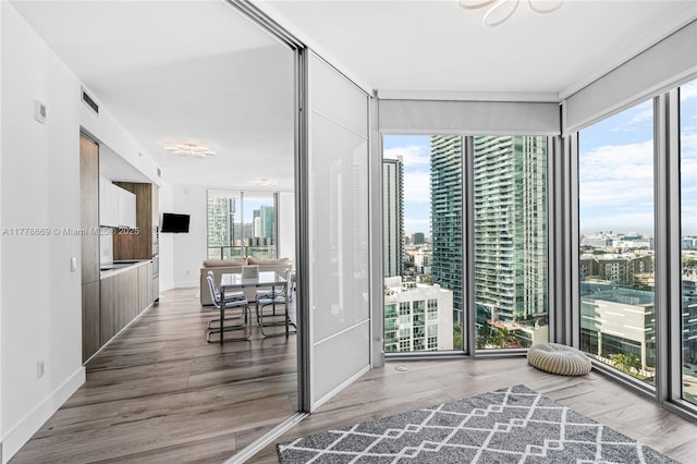 2900 NE 7th Ave Unit 1609, Miami, FL 33137 - living area with wood finished floors and a wall of windows