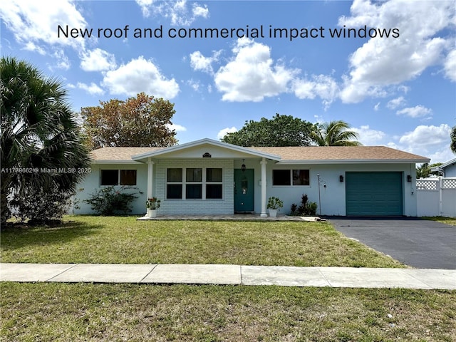 1625 E River Dr, Margate, FL 33063 - ranch-style house with a garage, asphalt driveway, and stucco siding