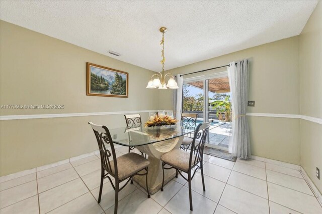 1625 E River Dr, Margate, FL 33063 - dining area with a chandelier, a textured ceiling, and light tile patterned flooring
