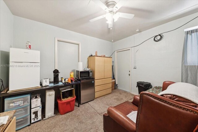 1625 E River Dr, Margate, FL 33063 - bathroom featuring a shower stall, toilet, vanity, wainscoting, and tile walls