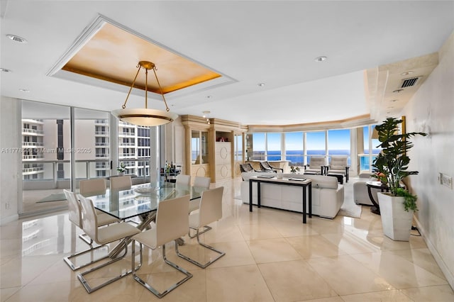 21150 NE 38th Ave Unit 2106, Aventura, FL 33180 - dining space featuring visible vents, a wall of windows, and a raised ceiling