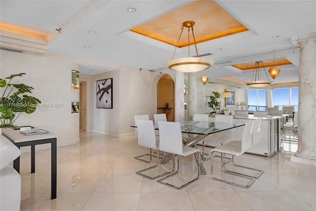 21150 NE 38th Ave Unit 2106, Aventura, FL 33180 - dining room featuring light tile patterned floors, baseboards, a raised ceiling, and arched walkways