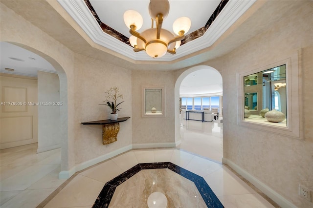 21150 NE 38th Ave Unit 2106, Aventura, FL 33180 - hallway with ornamental molding, baseboards, and arched walkways
