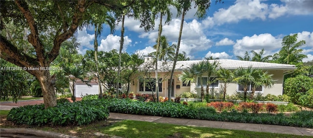 1001 S Alhambra Cir, Coral Gables, FL 33146 - view of front facade featuring stucco siding and an attached garage