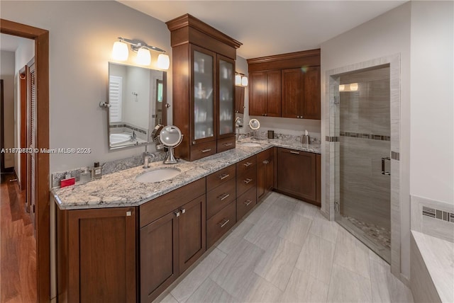 1001 S Alhambra Cir, Coral Gables, FL 33146 - full bath with double vanity, a stall shower, and a tub