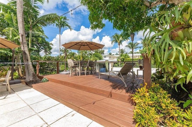 1001 S Alhambra Cir, Coral Gables, FL 33146 - wooden deck with outdoor dining area