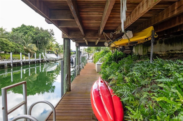 1001 S Alhambra Cir, Coral Gables, FL 33146 - dock area featuring a water view and boat lift
