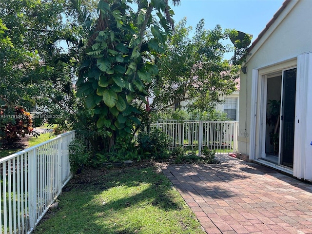 view of yard with a patio area and a fenced backyard