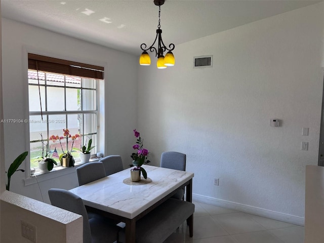 18769 SW 28th St, Miramar, FL 33029 - dining area with baseboards, a chandelier, and light tile patterned flooring