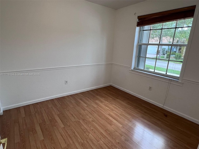 18769 SW 28th St, Miramar, FL 33029 - spare room with baseboards and wood finished floors