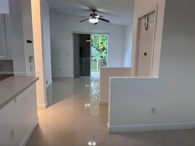 18769 SW 28th St, Miramar, FL 33029 - hallway featuring baseboards, light tile patterned flooring, and vaulted ceiling