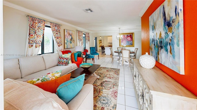living area with an inviting chandelier, visible vents, ornamental molding, and light tile patterned flooring