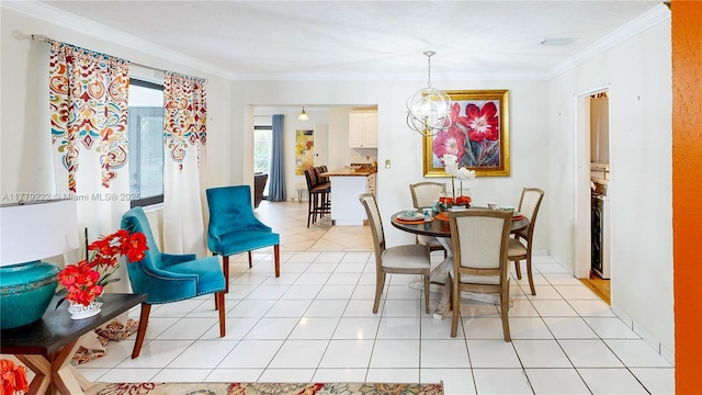 dining area featuring crown molding, light tile patterned floors, and a notable chandelier