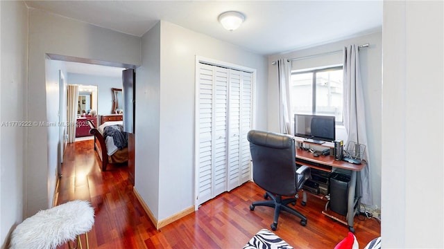 office featuring baseboards and wood finished floors