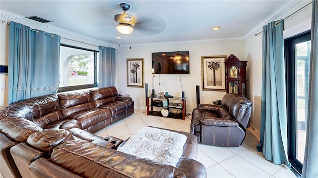 living room featuring visible vents, ceiling fan, ornamental molding, and light tile patterned flooring