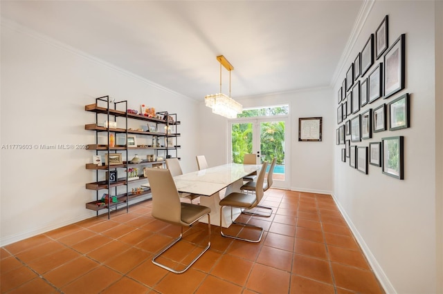 dining room with tile patterned floors, french doors, baseboards, and ornamental molding