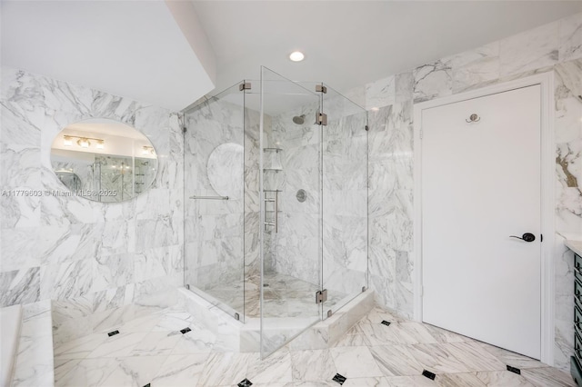 full bathroom with a marble finish shower, stone wall, recessed lighting, and marble finish floor
