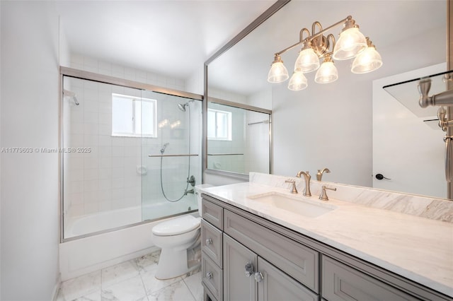 full bath featuring combined bath / shower with glass door, toilet, marble finish floor, and vanity