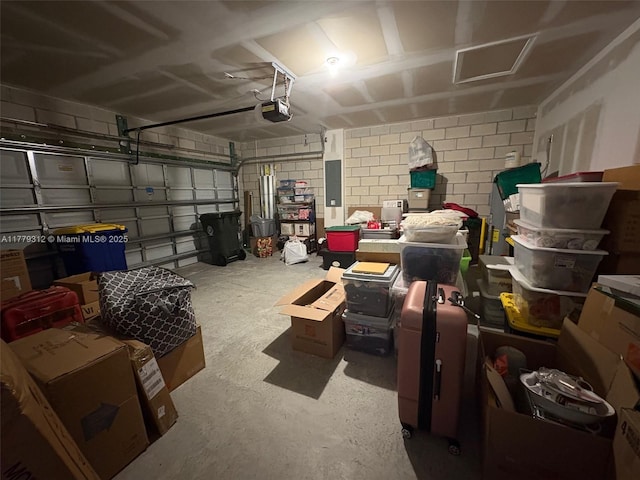 garage featuring electric panel and a garage door opener