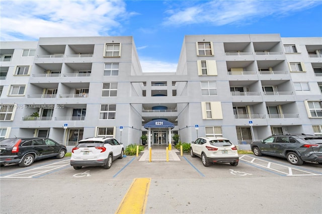 view of property featuring uncovered parking