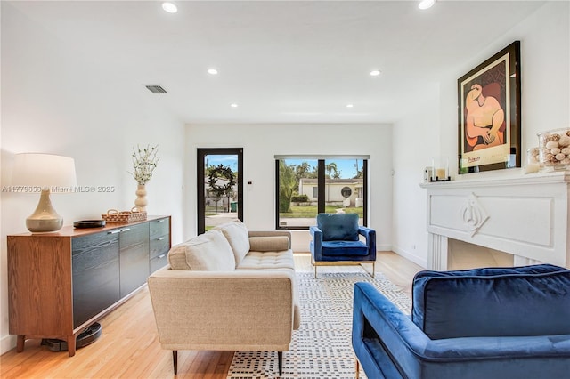 2019 SW 17th Ter, Miami, FL 33145 - living room with light wood-type flooring, recessed lighting, and baseboards