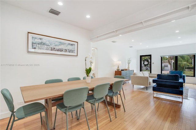 2019 SW 17th Ter, Miami, FL 33145 - dining space featuring arched walkways, light wood-style flooring, and recessed lighting