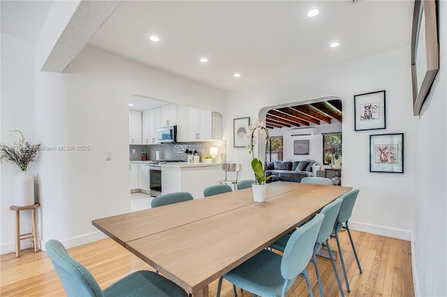 2019 SW 17th Ter, Miami, FL 33145 - dining space featuring arched walkways, light wood finished floors, baseboards, and recessed lighting