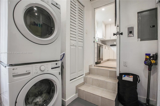 2019 SW 17th Ter, Miami, FL 33145 - laundry room with electric panel, stacked washing machine and dryer, baseboards, and recessed lighting