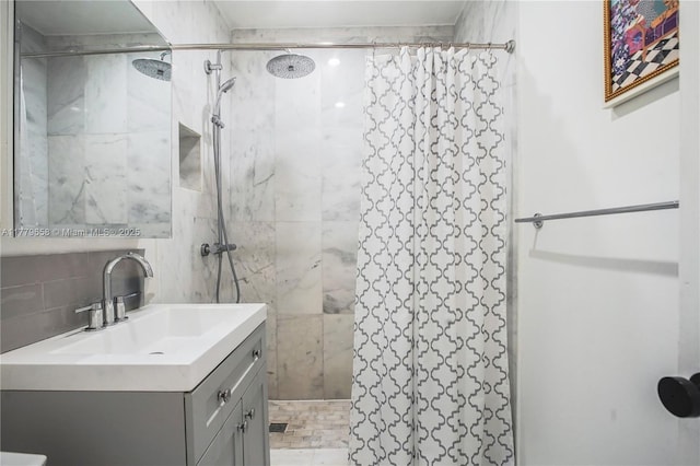 2019 SW 17th Ter, Miami, FL 33145 - full bath with tiled shower, vanity, backsplash, and tile walls