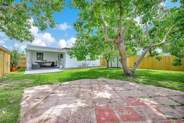2019 SW 17th Ter, Miami, FL 33145 - rear view of property featuring a storage unit, a patio area, an outdoor structure, stucco siding, and an outdoor hangout area