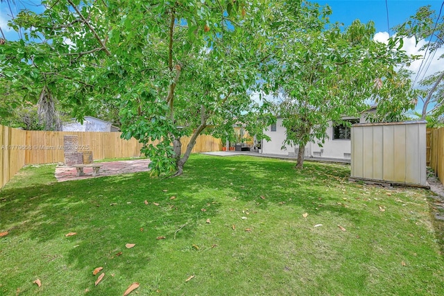 2019 SW 17th Ter, Miami, FL 33145 - view of yard with an outbuilding, a patio, and a storage unit