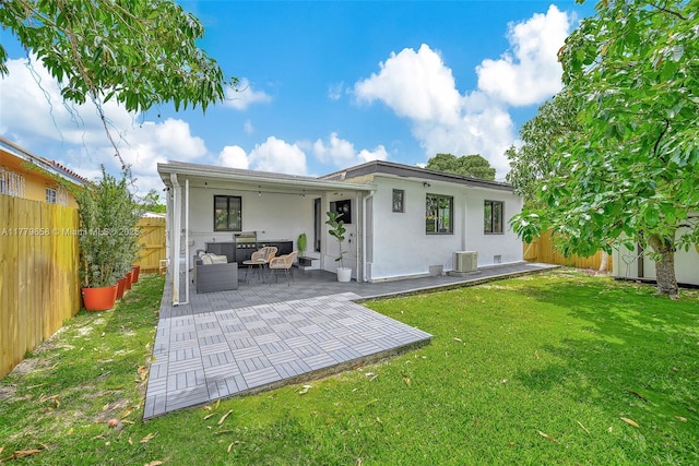 2019 SW 17th Ter, Miami, FL 33145 - rear view of house with stucco siding, central air condition unit, outdoor lounge area, and a patio area
