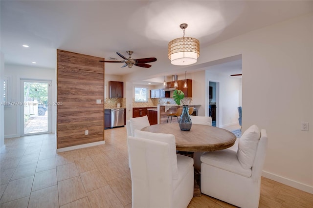 dining space with recessed lighting, ceiling fan, and baseboards