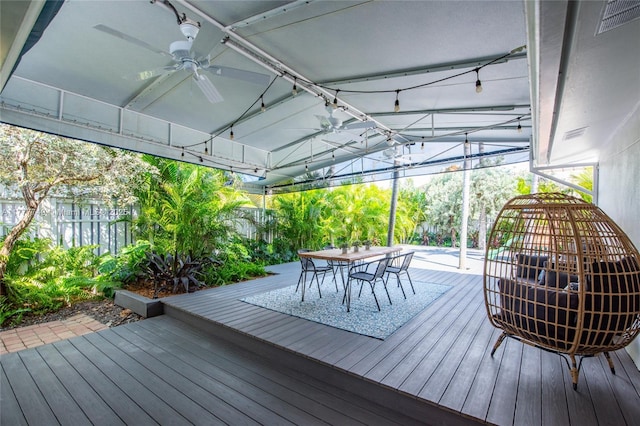 wooden deck with visible vents, outdoor dining space, and a ceiling fan