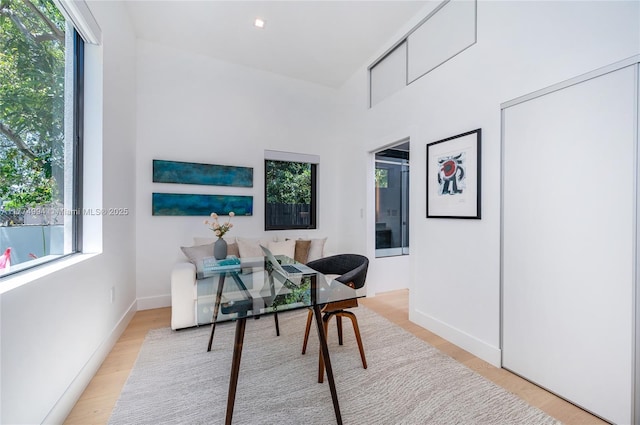 office space featuring wood finished floors and baseboards