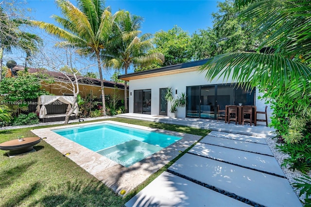 outdoor pool featuring a patio, fence, and a lawn
