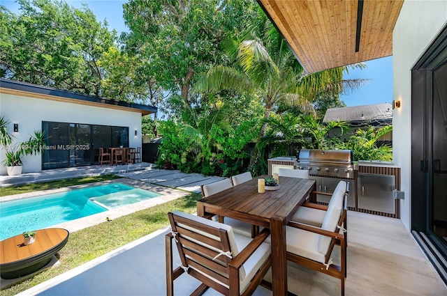 pool featuring grilling area, outdoor dining space, a patio, and area for grilling