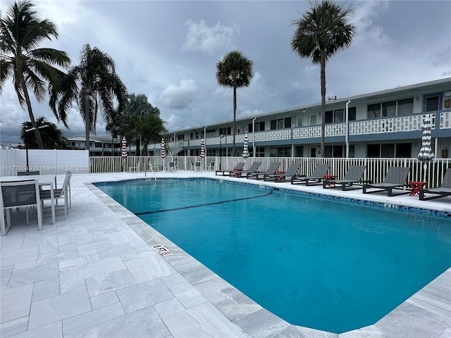 801 Atlantic Shores Blvd Unit 203, Hallandale Beach, FL 33009 - community pool with fence and a patio area